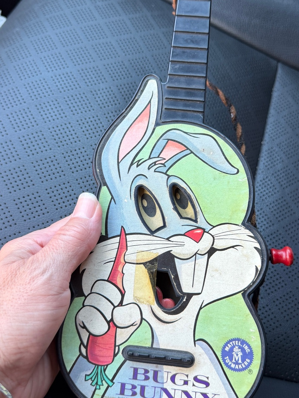 Mattel Black Bug-Shaped Musical Toy Guitar with Red Accent